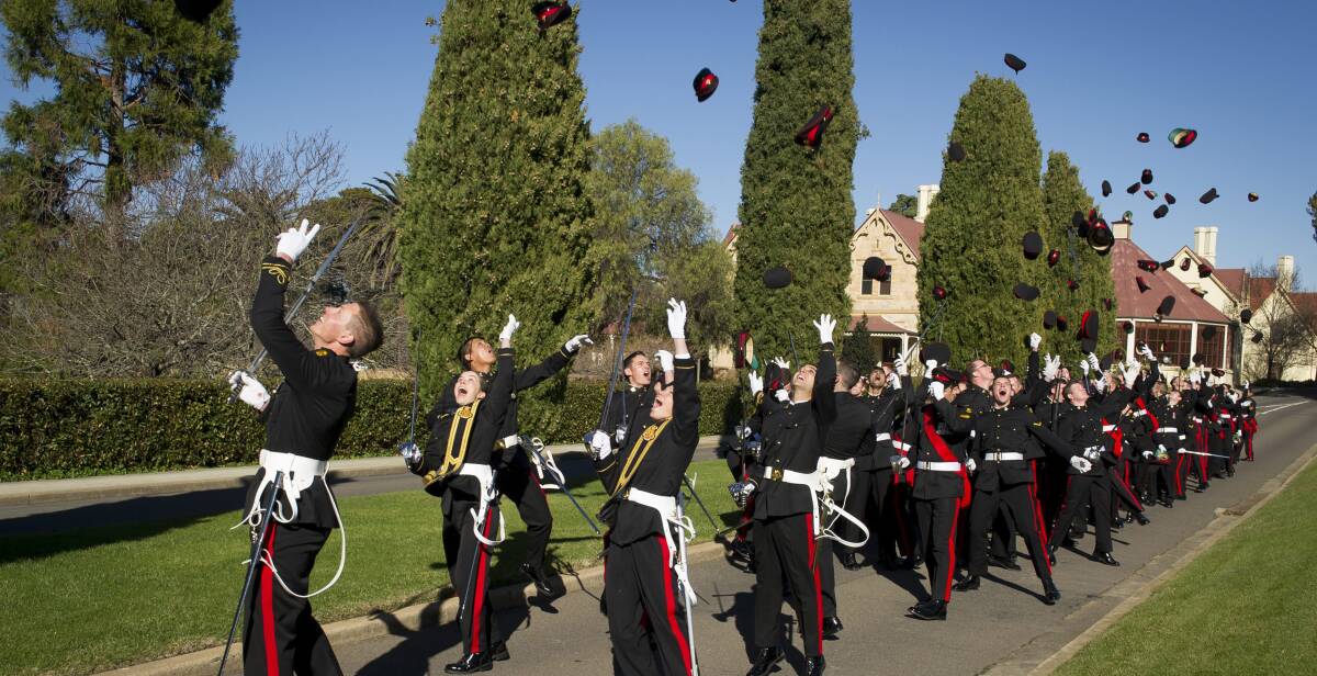 CELEBRATION: New Army graduates celebrate at the Royal Military College-Duntroon ceremony. Photo: COMMONWEALTH OF AUSTRALIA, DEPARTMENT OF DEFENCE