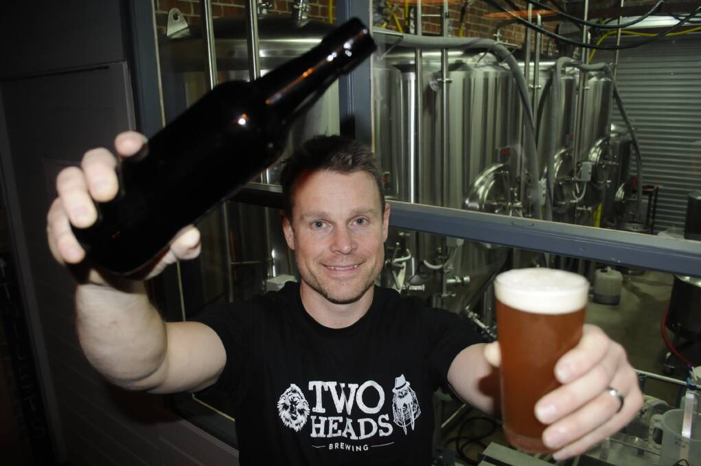 DRINK TO THAT: Two Heads Brewing co-owner Greg Headley is pleased plans to start bottling beer are being realised earlier than expected. Photo:CHRIS SEABROOK 092116c2heads1a