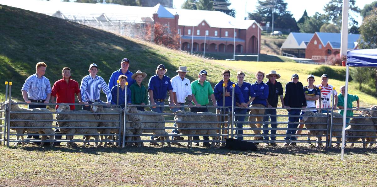 SNAPSHOT: St Stanislaus' College students learnt about merinos from sheep expert Stuart Hodgson on Wednesday. Photo: PHIL BLATCH