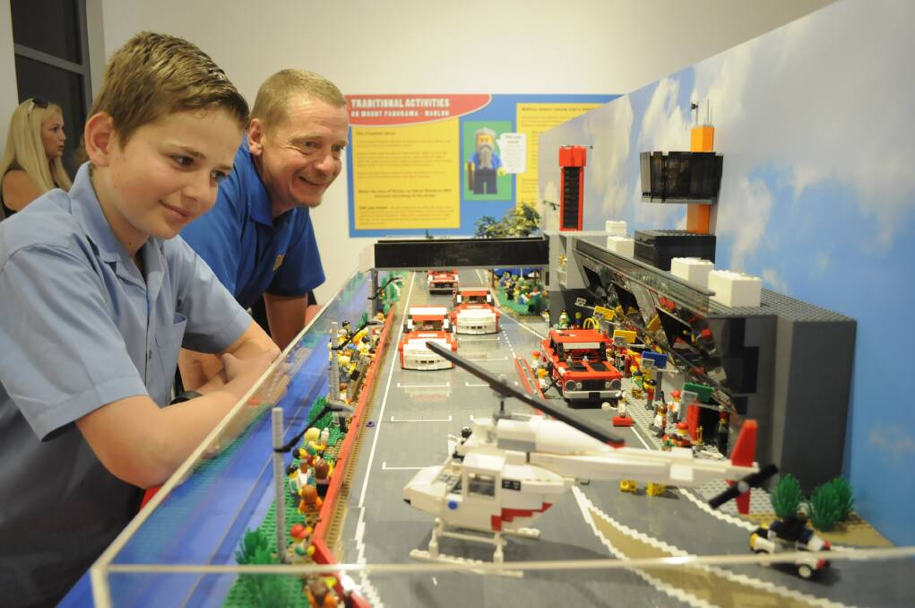 FUN: Pete Starkey took his son Will, 11, to see the LEGO exhibition while it was at Bathurst Regional Art Gallery. Photo:CHRIS SEABROOK 113016clego1
