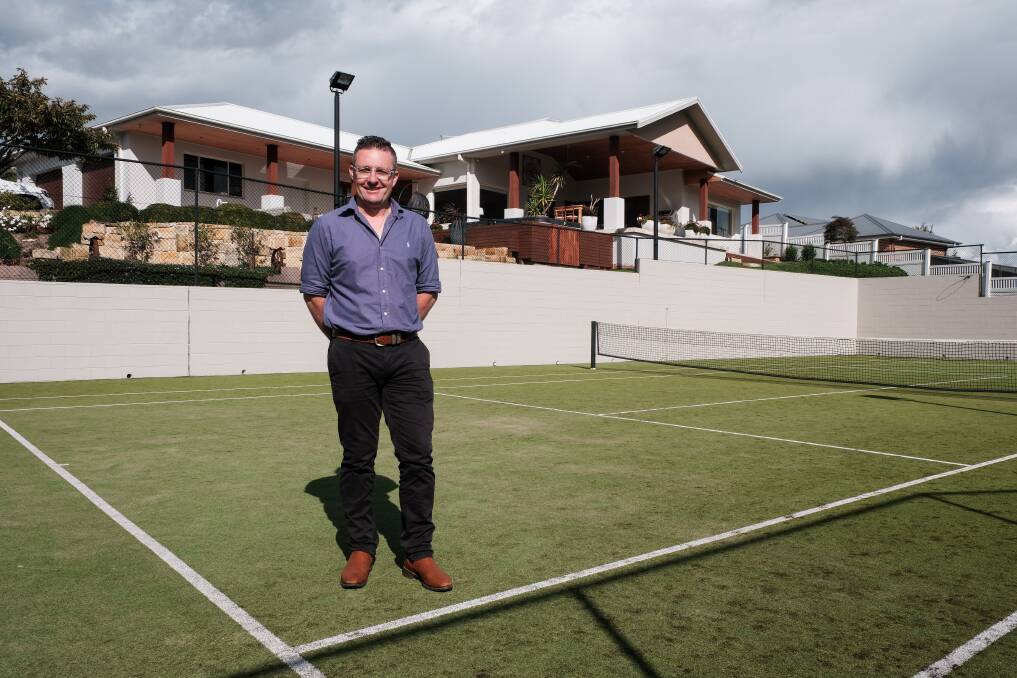 Raine and Horne Bathurst director Grant Maskill-Dowton standing on the tennis court at 4 Negundo Place. Picture by James Arrow