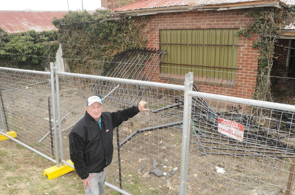 DISAPPOINTING: Councillor Bobby Bourke was not happy to see a section of the fence around the Bathurst Gasworks site destroyed. Photo: CHRIS SEABROOK 082117cgaswks2