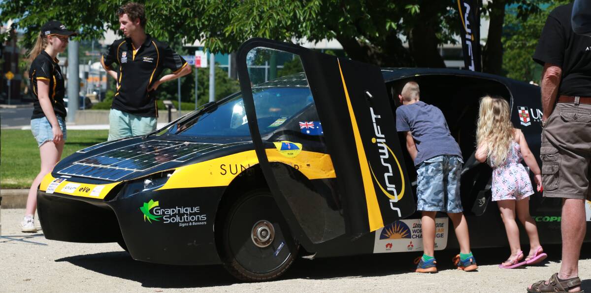 SNAPSHOT: The solar-electric vehicle that arrived in Bathurst on Saturday was a source of fascination, as well as clean energy. Photo: PHIL BLATCH 