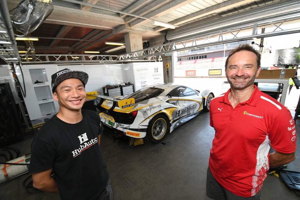 THEY HAVE ARRIVED: Team manager Jerry Lin with operations manager and chief engineer Phillip Di Fazio with their HubAuto Corsa Ferrari 488 GT3. Photo: CHRIS SEABROOK 012819cferrari1