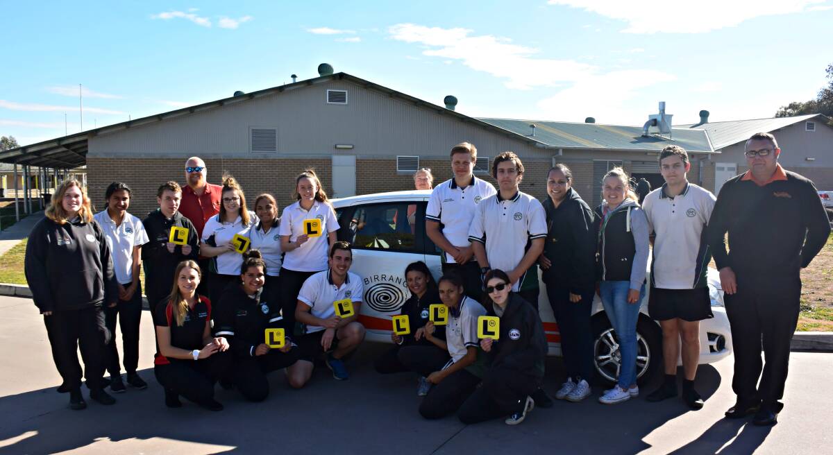 SUCCESSFUL: Students from Denison College Kelso, along with the teachers and instructors who have helped make the learner driver program happen. 