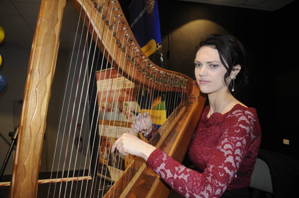 SNAPSHOT: Bethany Carter provided music on her lever harp at the Rotary Club of Bathurst's  Emergency Service Awards. Photo: CHRIS SEABROOK 