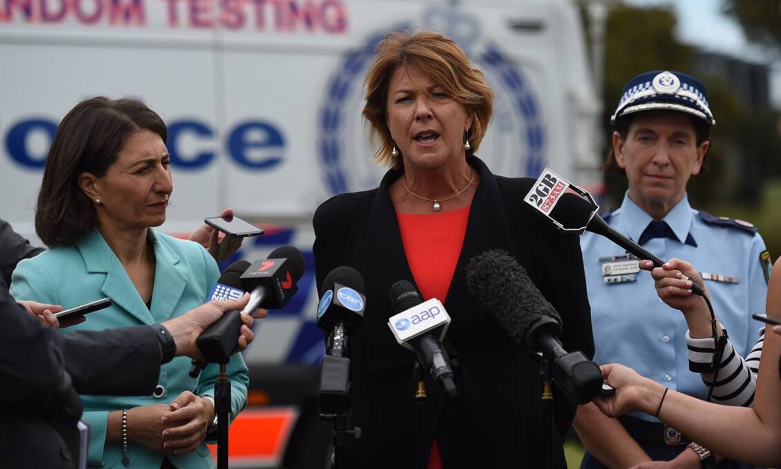 NSW Transport Minister Melinda Pavey, flanked by Premier Gladys Berejiklian and Assistant Commissioner Catherine Burns, at a road safety announcement on Tuesday. Photo: KATE GERAGHTY