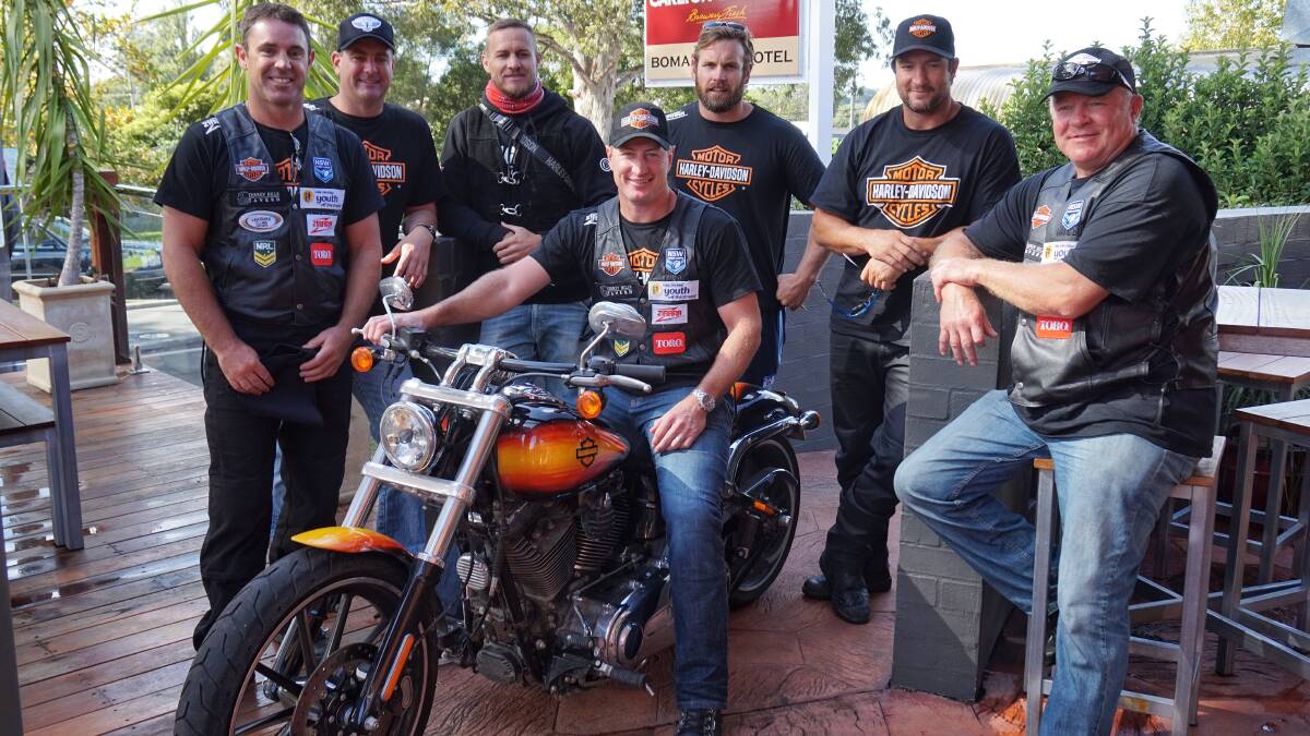 CAMPAIGN: Brad Fittler (left) and a host of former professional rugby league players including Steve Menzies (on bike) will come to Orange.