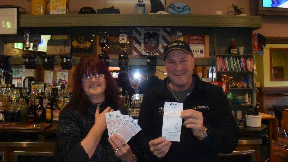 NUMBERS GAME: Lucky Keno winner Judy Lowe and Royal Hotel licensee Michael Chappell holding the winning ticket.