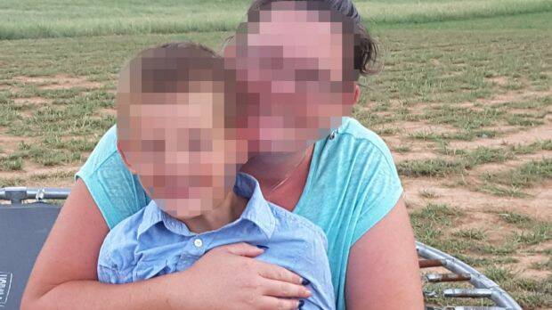 One of the two pre-schoolers with his mother, who was left on a bus for six hours. Both mother and son cannot be named for legal reasons. Photo: Supplied