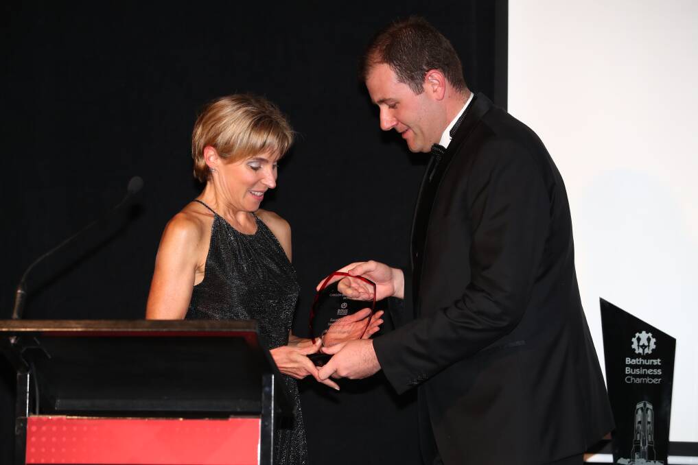 Double the success: Melissa Gregory from Bobbies Clothing receiving one of two awards at the 2017 Peak Connect Carillon Business Awards. Photo: Phil Blatch.