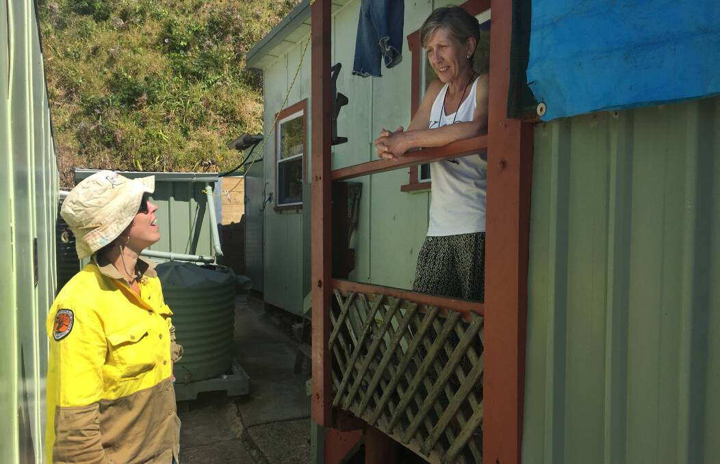 NPWS ranger Susanne Callaghan talks with hut user Marg Moore. Picture: Scott Bevan