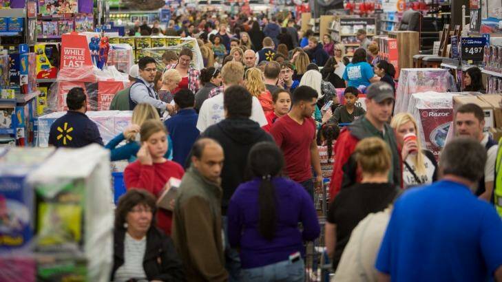 Customer flooding a Walmart store in Rogers, Arkansas, during last year's Black Friday sales.  Photo: Gunnar Rathbun