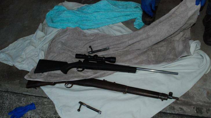 Police uncovered a .303 rifle, a .223 Remington rifle and ammunition during a search at a Gipps St unit in Wollongong following Daniel Tarvij's arrest. He has been charged with firearm offences.  Photo: Police Media Unit
