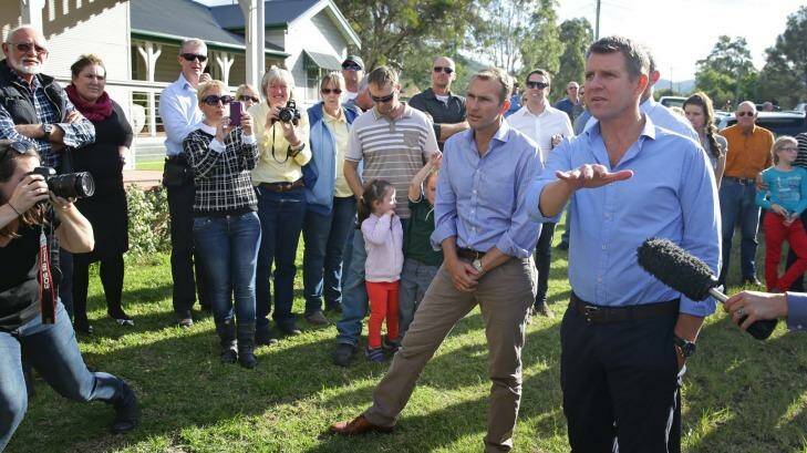 NSW Premier Mike Baird (with Planning Minister Rob Stokes, left) talks to locals in Bulga.   Photo: Marina Neil 