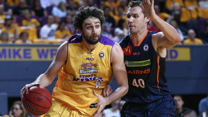 In control: Julian Khazzouh of the Kings charges past Alex Loughton of the Taipans. Photo: Ryan Pierse