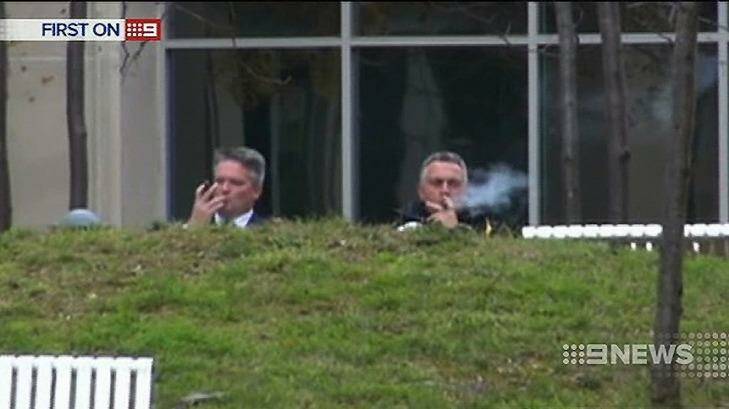 Joe Hockey enjoys a cigar with Mathias Cormann before the 2014 budget was announced.