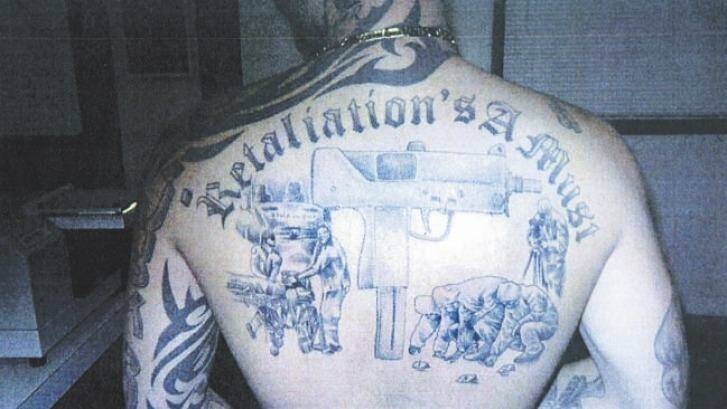 Michael Odisho's back tattoos denote his gang allegiances.
 Photo: Supplied
