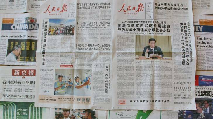 Don't mention the collapse: the People's Daily avoids mention of stockmarket falls in its Tuesday and Wednesday editions, even as other newspapers cover the situation.
 Photo: Sanghee Liu