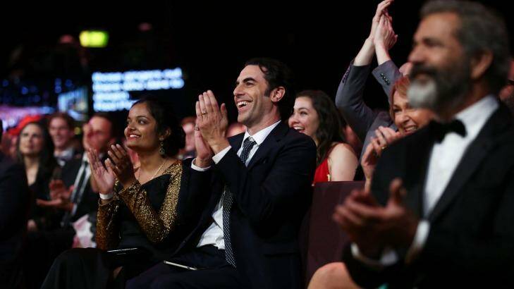 Isla Fisher's husband Sacha Baron Cohen applauding his wife during the 6th AACTA Awards. Photo: Mark Metcalfe