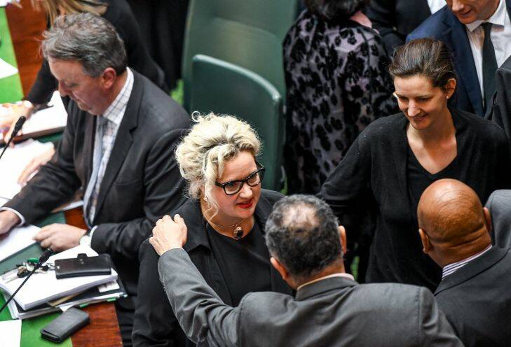 The Age, News, 20/10/2017, Photo by Justin McManus. State Parliament in an all night sitting debating the euthanasia bill. Health minister Jill Hennessy is congratulated after the passing of the bill.
