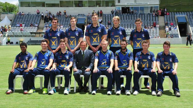 Tony Abbott joins a team photograph with the PM's XI team ahead of January's match. The 2015-16 summer match has been brought forward to October. Photo: Melissa Adams