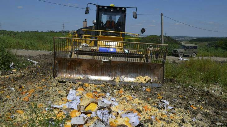 Illegally imported food is destroyed in the Belgorod region, Russia, on Thursday. 