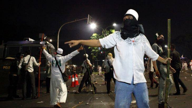 Protesters clash with police at the end of an anti-Ahok rally in Jakarta in November.   Photo: Roni Bintang