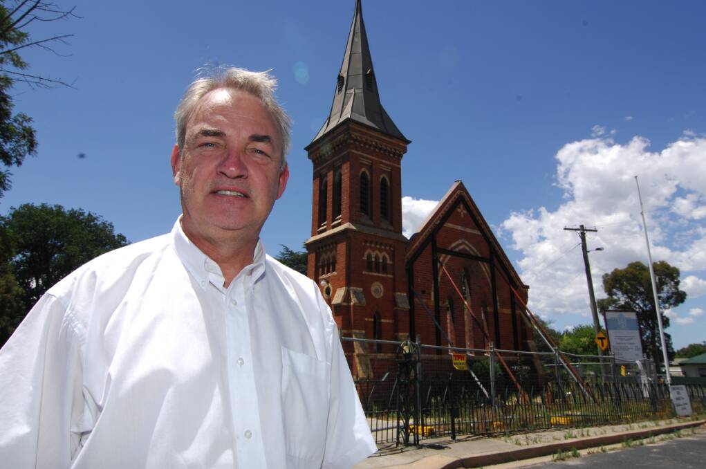 BRINGING CHRISTMAS HOME: Reverend James Hodson said the Anglican Diocese of Bathurst would hold its Christmas Eve service outside the remains of St Barnabas Church. Photo: ZENIO LAPKA	 121514zhodson