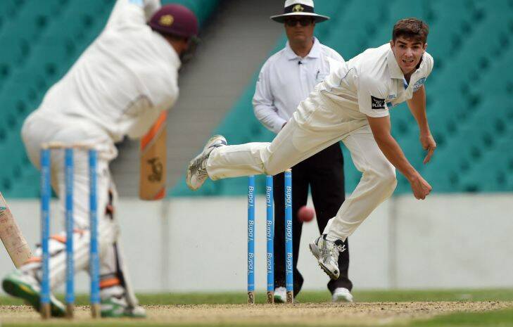 New South Wales cricket player Sean Abbott (R) sends down a delivery to Queensland batsman Marnus Labuschagne (L) on the first day of their Sheffield Shield match at the Sydney Cricket Ground (SCG) on December 9, 2014.  Abbott is playing in his first match since bowling the delivery which killed Australian batsman Phillip Hughes at the same ground on November 25, 2014.  AFP PHOTO/William WEST    --IMAGE RESTRICTED TO EDITORIAL USE ONLY - STRICTLY NO COMMERCIAL USE--