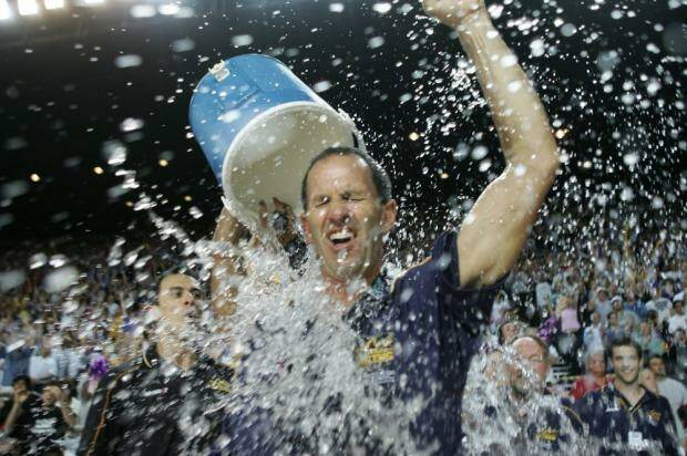 Brian Goorjian gets a soaking from CJ Bruton as the Kings celebrate the three peat in 2005. Photo: Tim Clayton