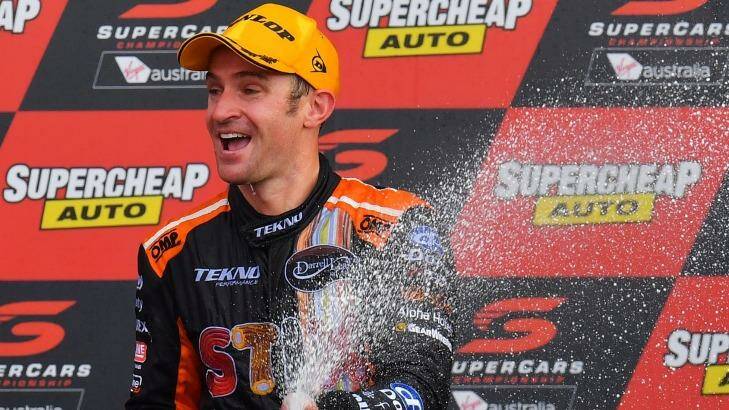 Corker: Will Davison of Tekno Autosports Holden celebrates on the podium after winning the Bathurst 1000 at Mount Panorama. Photo: Daniel Kalisz