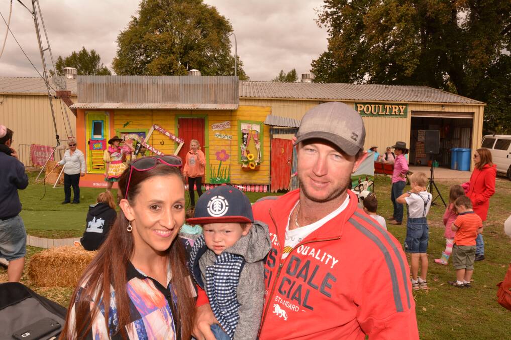 A FAMILY SHOW: Jennifer Rayner with baby Hunter and fiance Nathan Dennis at the Royal Bathurst Show yesterday. Photo: ZENIO LAPKA 	041915zfamily1.