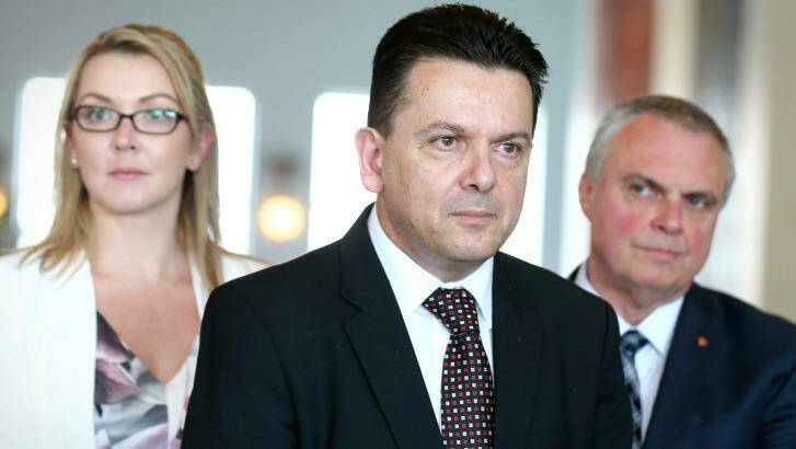 NXT senators Skye Kakoschke-Moore, Nick Xenophon and Stirling Griff address the media on the party's deal with the Prime Minister. Photo: Alex Ellinghausen