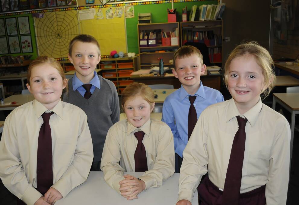 TESTING TIMES: St Philomena's Primary School Year 3 students (front) Hannah and Ruby Dunn, Lara Farraway, (back) Tony Palucci and William Varian all said day one of their NAPLAN testing was easy . Photo: CHRIS SEABROOK 	051314cnaplan