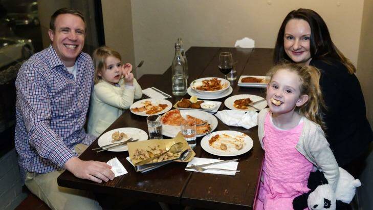 David Feeney, wife Lesley Healy and their girls Elsa and Maeve, at La Disfida restaurant in Haberfield, are part of the trend towards dining out early. Photo: Brook Mitchell