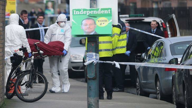 The body of Eddie Hutch is removed from a property in Poplar Row in Dublin after he was shot in his home in apparent retaliation for a fatal gun attack at the Regency Hotel. Photo: Niall Carson