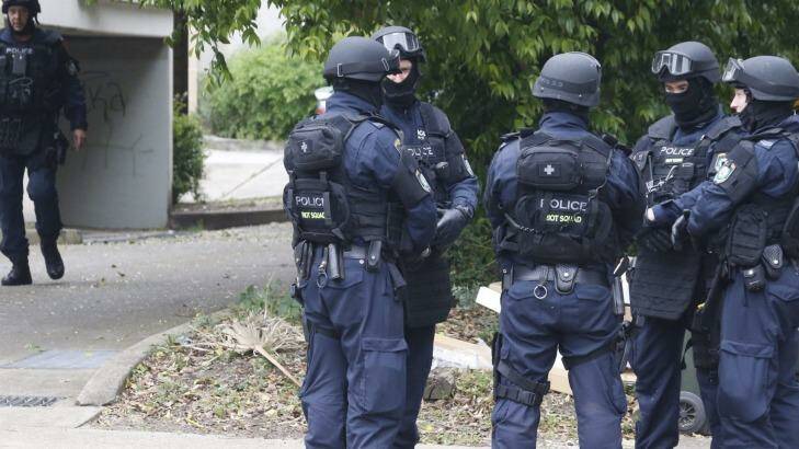 Police search a house in Sydney's west. Photo: Peter Rae