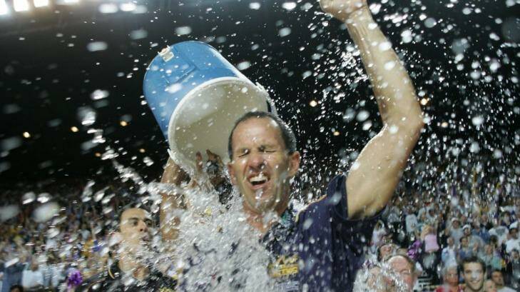 Brian Goorjian gets a soaking from CJ Bruton as the Kings celebrate the three peat in 2005. Photo: Tim Clayton