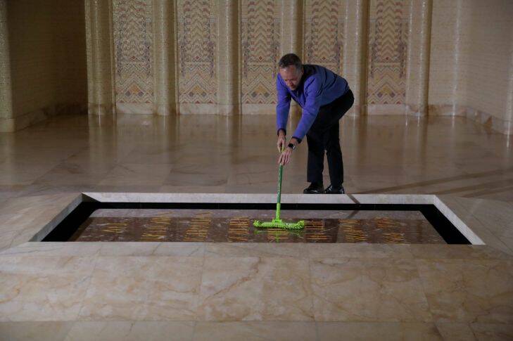 Opposition Leader Bill Shorten cleans the Tomb of the Unknown Australian Solider at the Australian War Memorial in Canberra on Friday 16 June 2017. Photo: Andrew Meares 
