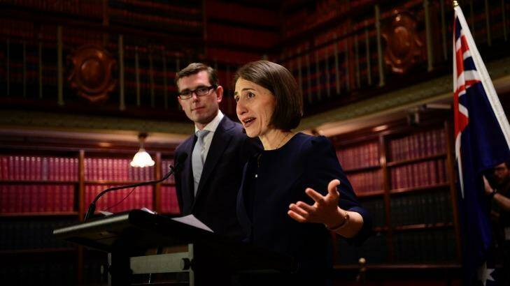 NSW Premier Gladys Berejiklian speaks at a press conference with new Tresaurer Dominic Perrottet. They are spearheading the LPI transaction. Photo: Wolter Peeters