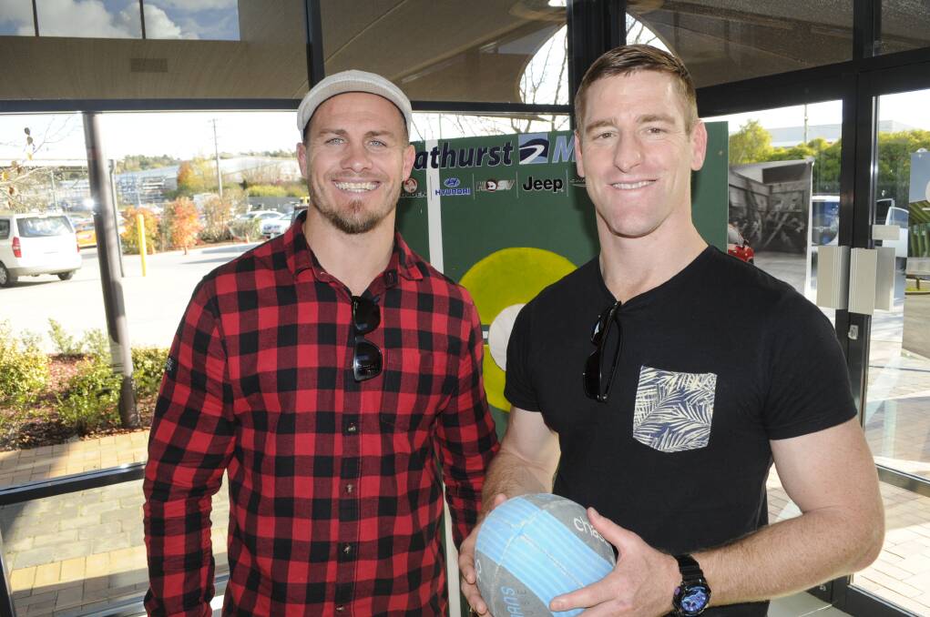 OLD RIVALS: Former Origin stars Matt Cooper of the Blues and the Maroons Brent Tate were in Bathurst on Monday as part of the Big4 Road To Origin Tour. Photo: CHRIS SEABROOK 	051815corigin5