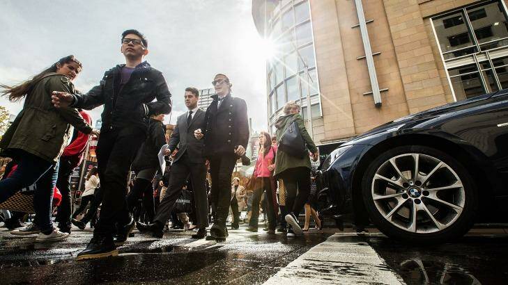 Council strategy: Pedestrians cross George Street in Sydney's central business district. Photo: Joosep Martinson
