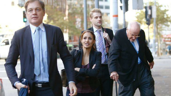 Rachelle Louise arrives for her defamation case on Wednesday, with Barrister Clive Evatt right.. Photo: Daniel Munoz