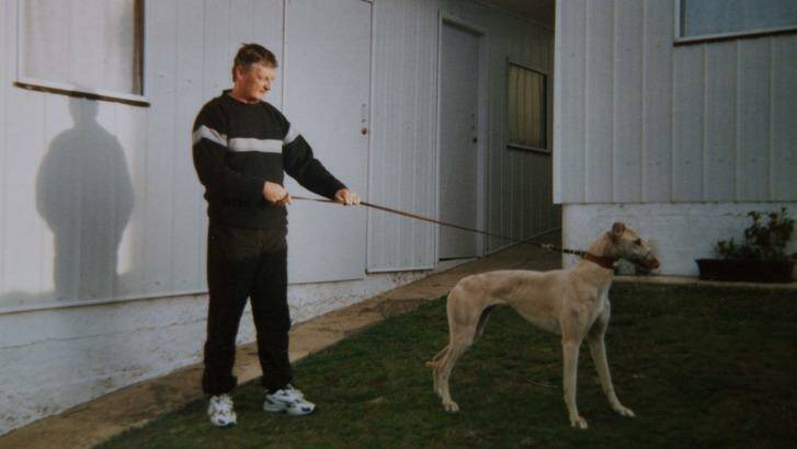 John Burrows, a local greyhound trainer, with Sandy, one of his greyhounds. Photo: Wolter Peeters