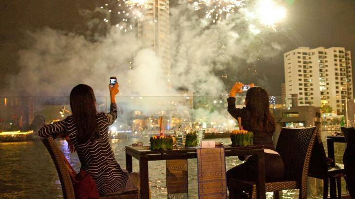 Loy Kratong Festival fireworks seen from across Chao Phraya River. Photo: John Borthwick