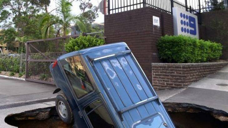 A four-wheel-drive stuck in a sink hole at the Channel Nine studios Photo: TV Tonight