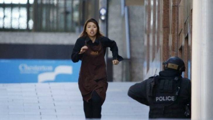 A hostage, believed to be Elly Chen, escapes during the siege Photo: Jason Reed/Reuters