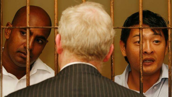 Andrew Chan (right) and Myuran Sukumaran talk with their Australian barrister, Julian McMahon, in 2010. Photo: Danny Arcadia