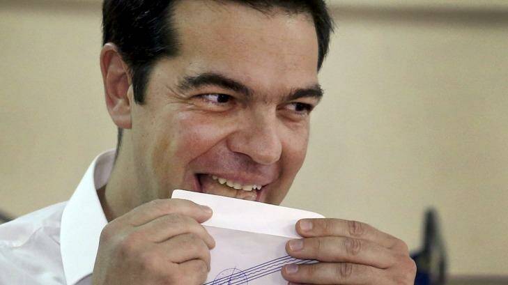 Greek Prime Minister Alexis Tsipras votes at a polling station in Athens on Sunday.   Photo: Alkis Konstantinidis 